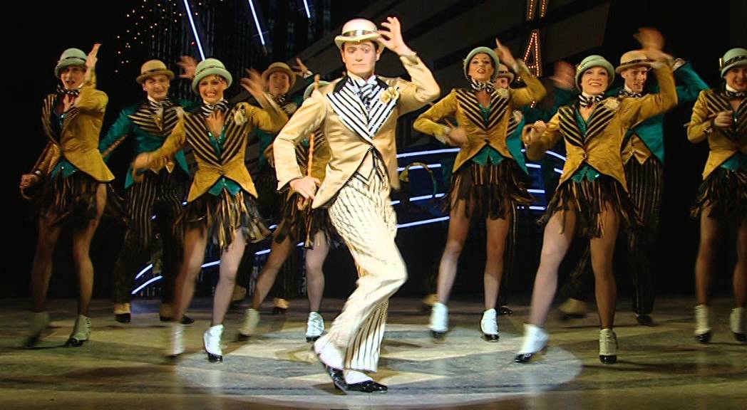 A new musical is set to star on Cunard’s Queen Elizabeth and Queen Victoria. Playing exclusively in the Royal Court Theatre, Top Hat is a romantic 1930s comedy set in the Golden Age of Hollywood. And it was this era that is known for its dazzling costumes and tap dancing. The production features music and lyrics by Irving Berlin, the musical is based on the 1953 RKO motion picture of the same name. The story follows the life of Jerry Travers a man who dances his way across Europe to win over the heart of society girl, Dale Tremont. The show first appeared in London in 2011 and won three prestigious Laurence Olivier awards including Best New Musical. "Top Hat perfectly matches the Frank Matcham style theatres on board Queen Victoria and Queen Elizabeth, which complement this visually outstanding show perfectly," said Matthew White, the production's original stage show director. White also co-adapted the stage script from the film and is now assisting with adapting the show for its at-sea premiere. "Top Hat" debuted on September 3 onboard Queen Victoria and will kick off on Queen Elizabeth on September 17. The musical will be exclusive to Cunard ships for the next four years.