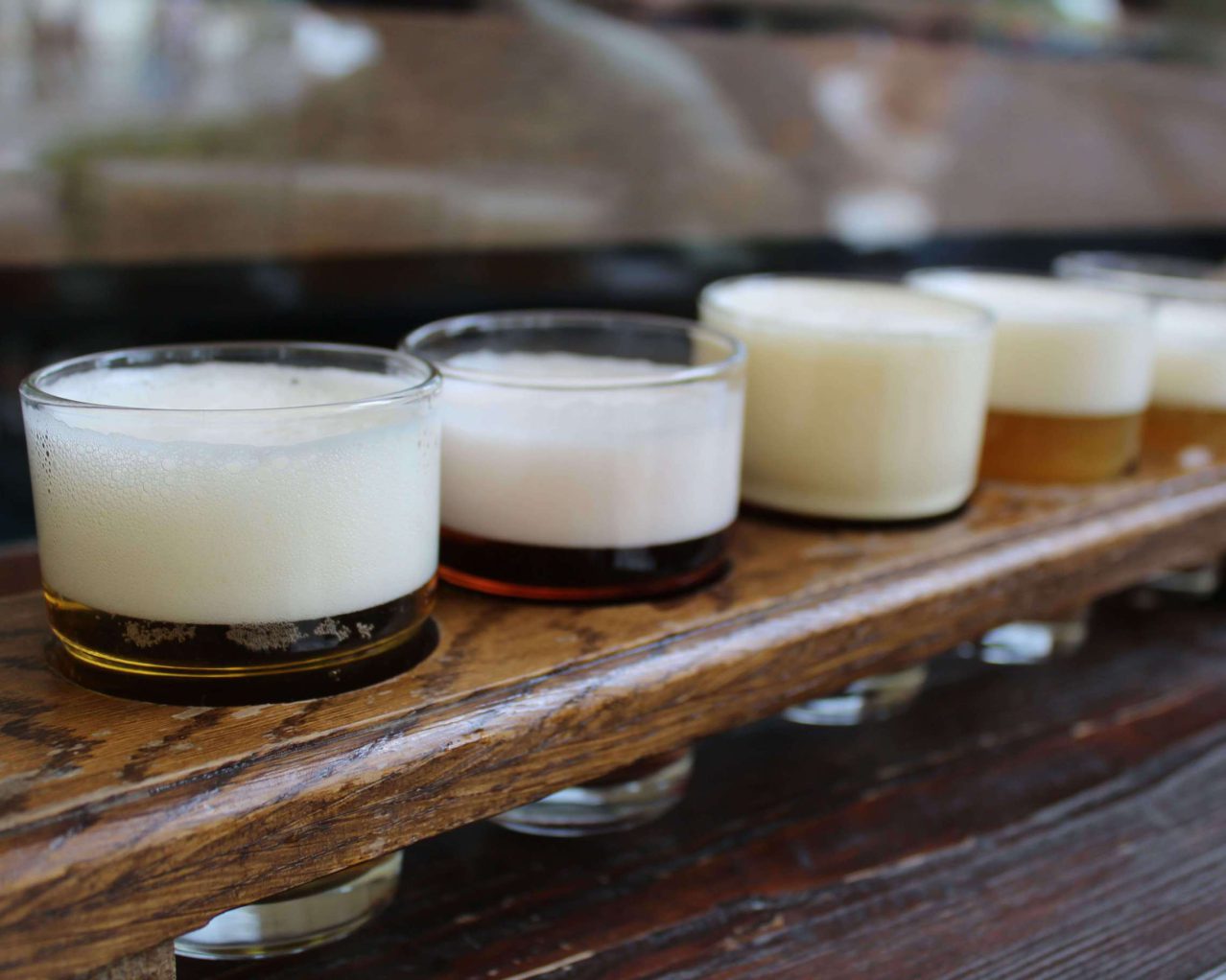 a tasting paddle of beers