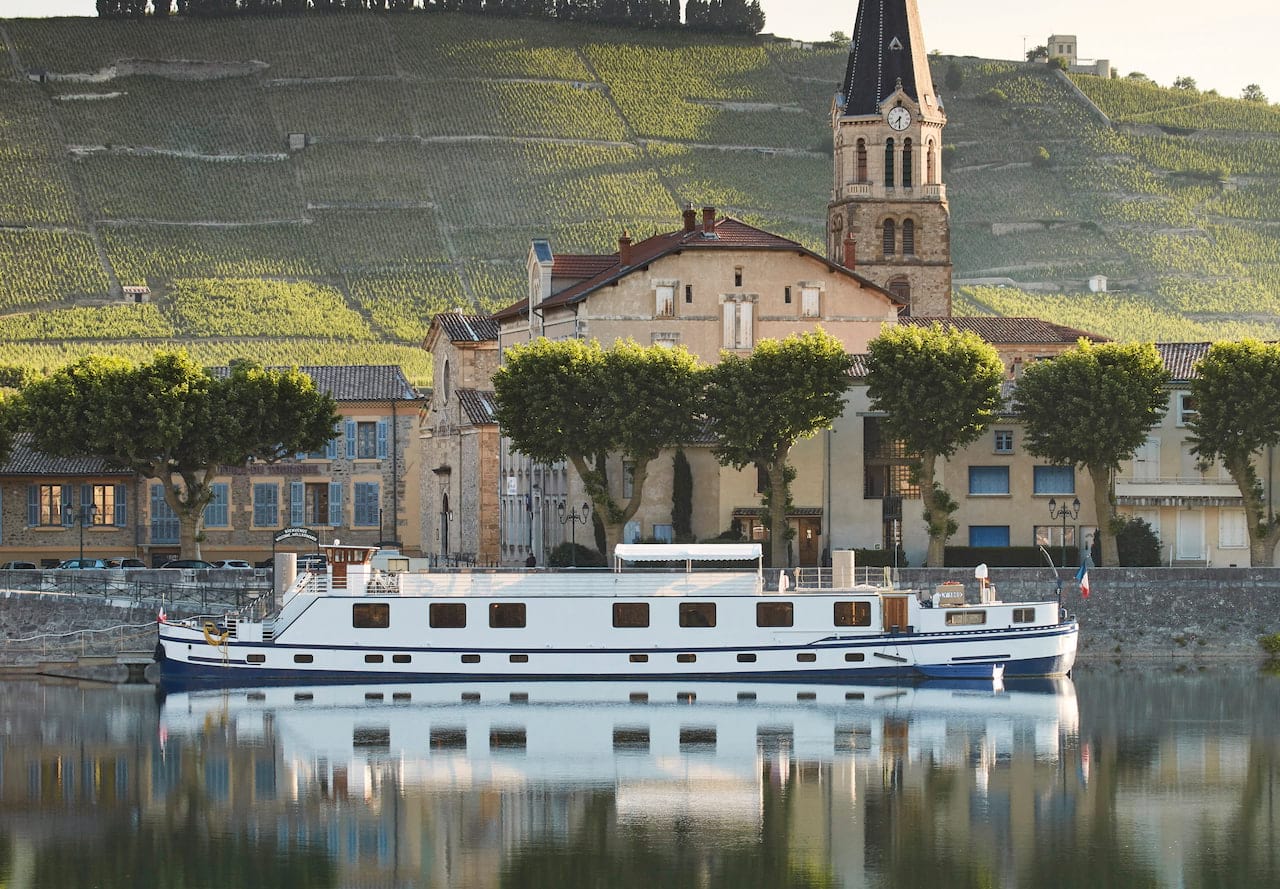 Cruise ship infront of river town