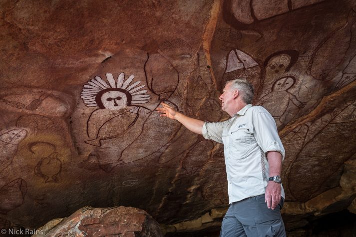 Mick Fogg examining the Gwion Gwionrock art