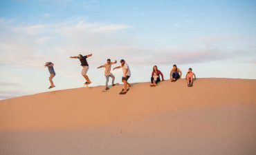Boarding down the Port Stephen's sand dunes