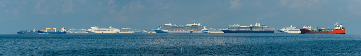 Cruise ships and container ships seen moored in Manila Bay