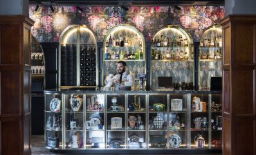 Bartender cleaning a glass