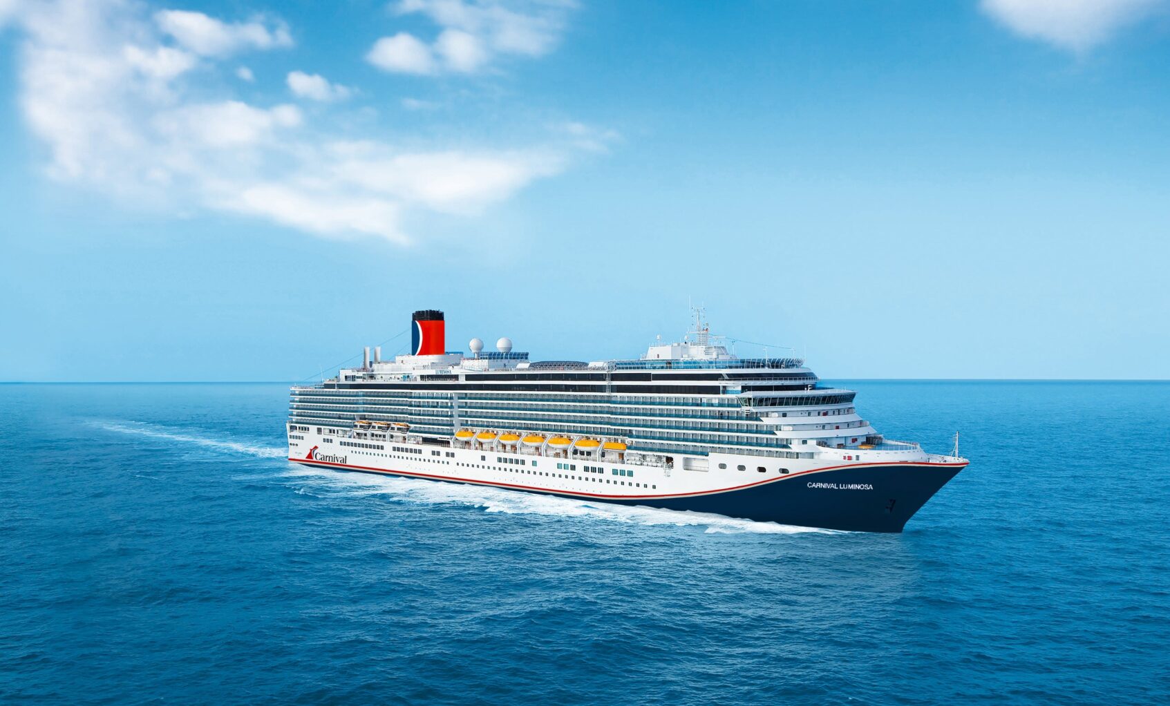 Carnival Luminosa sails through the ocean.