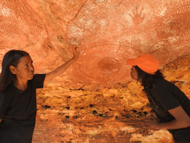 Isobel and Naomi explaining rock art Wijingarra Tours