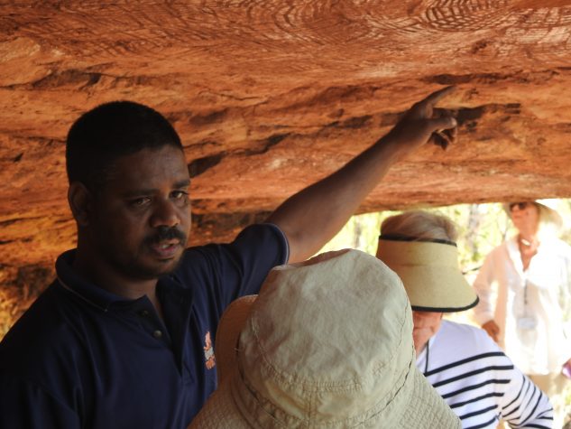 Wijingarra Tours 8 Neil explains rock art to a guest at Wijingarra Butt Butt.