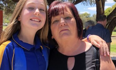 A mother and daughter taking a photo