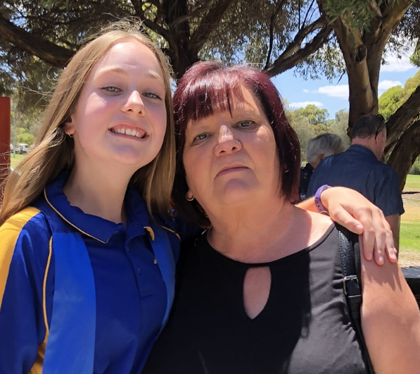 A mother and daughter taking a photo