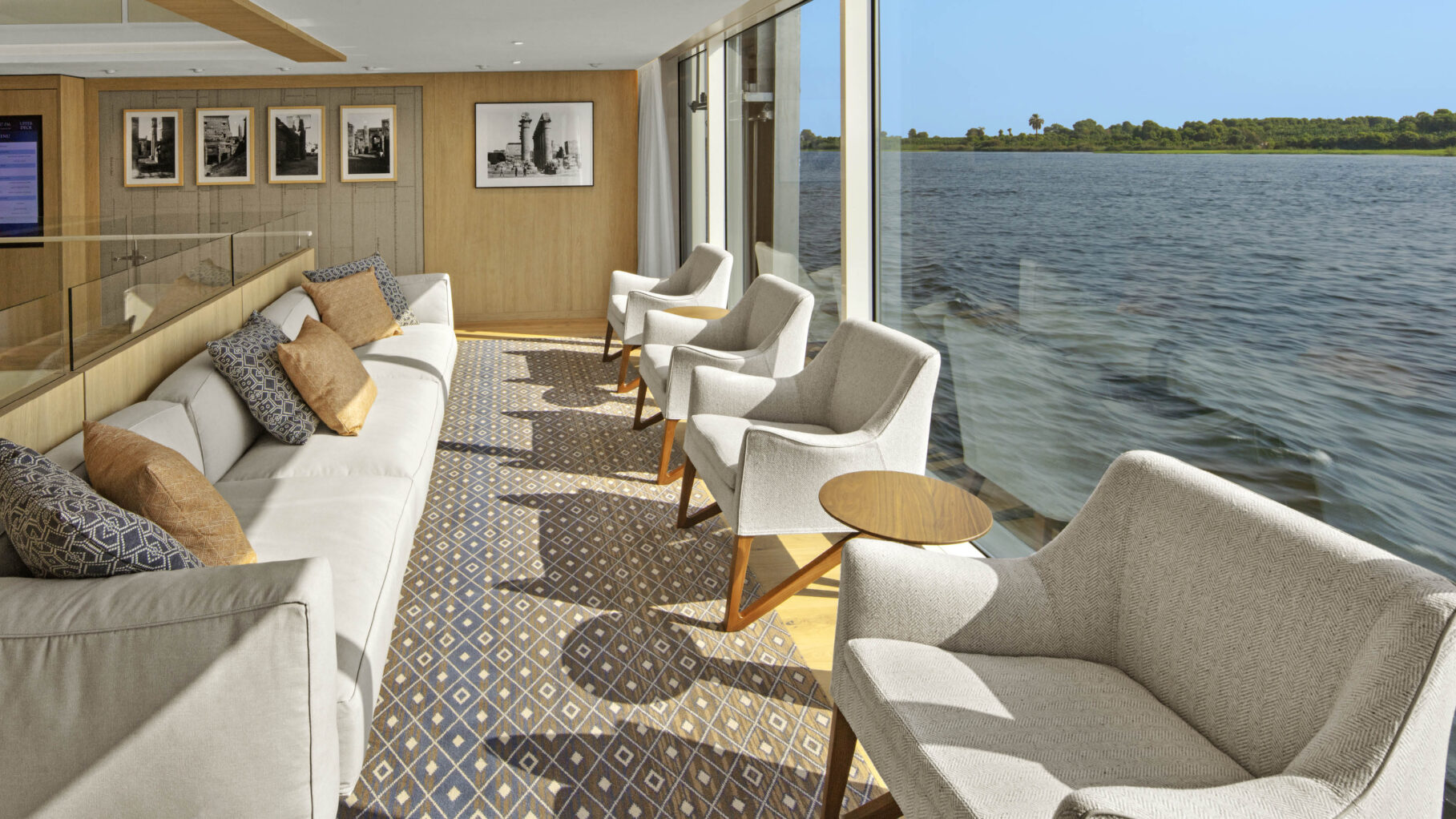 The Atrium Aton Sofa Chairs with large windows to river views on Viking Hathor 