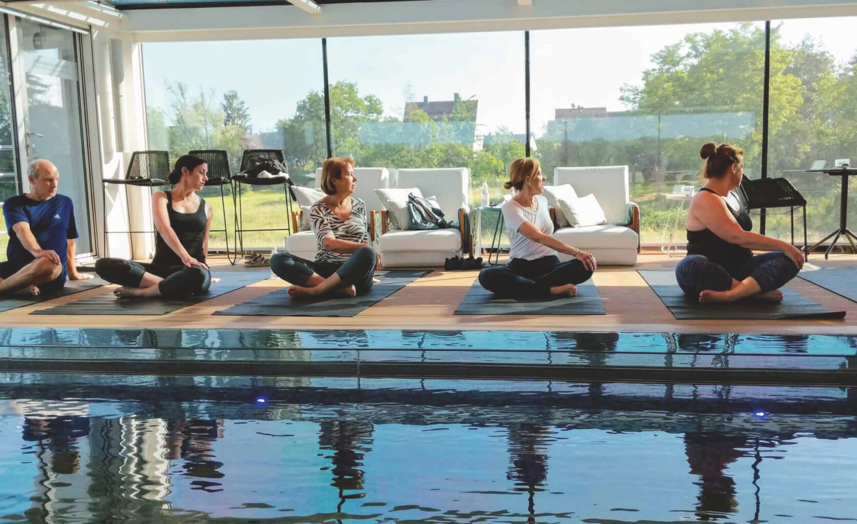 People practising yoga on an emerald cruise ship 