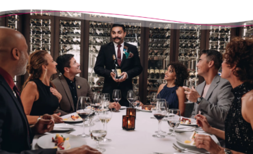 Changes to Princess dining people sitting around with sommelier