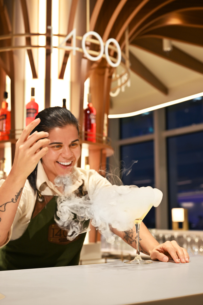 A Royal Caribbean Bartender drinks package sharing