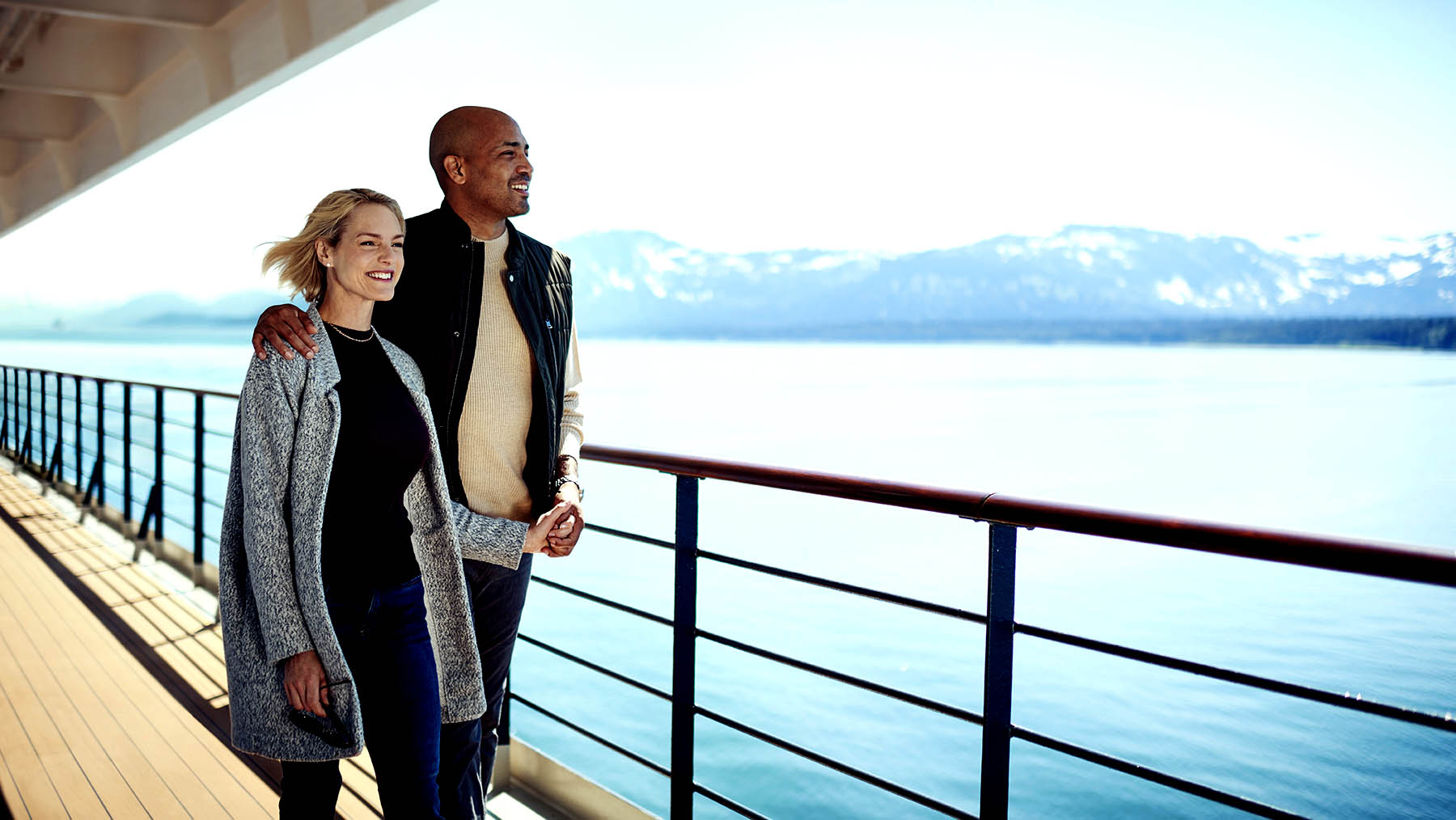 Guests enjoy the view aboard one of the 'queens' of Cunard Line. 