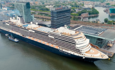 A cruise ship in port at Amsterdam cruise cuts.