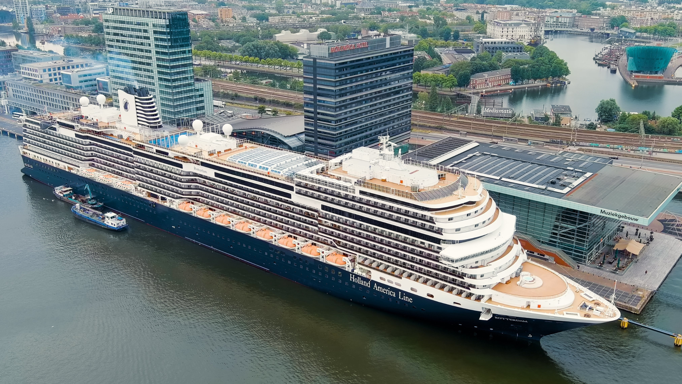 A cruise ship in port at Amsterdam cruise cuts.