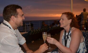 Deb and Matt cheers to their new engagement on deck on cruise proposal.