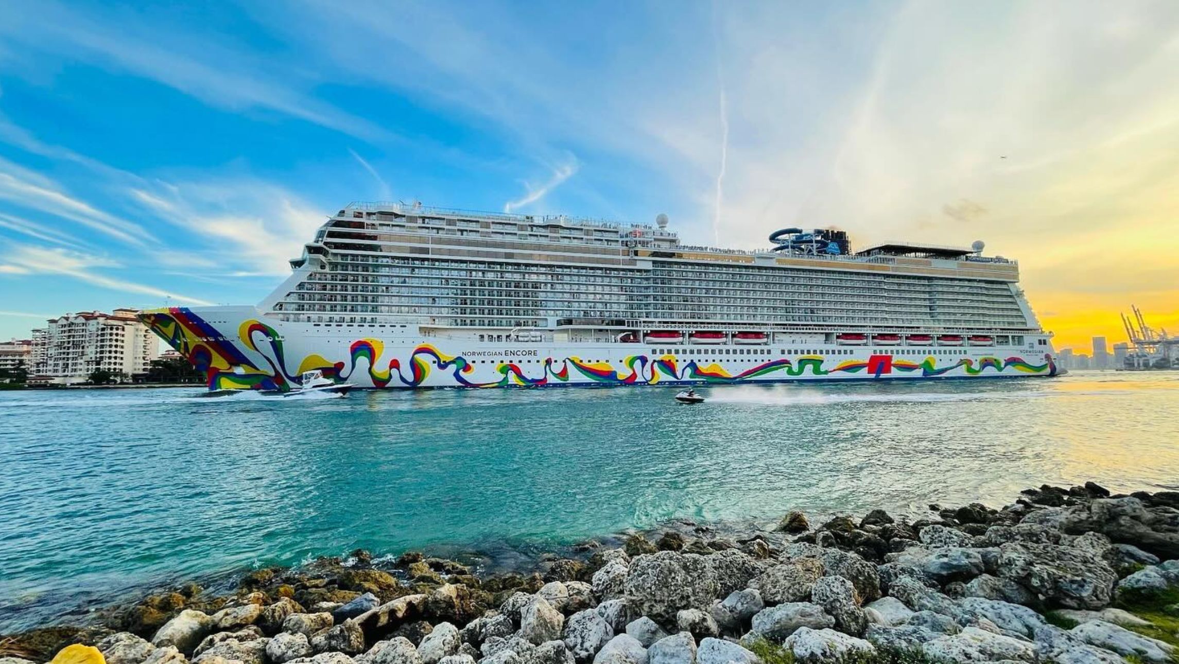 Norwegian Encore sailing in bright blue waters.