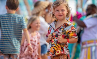 A young Royal Caribbean passenger smiles for a photo.
