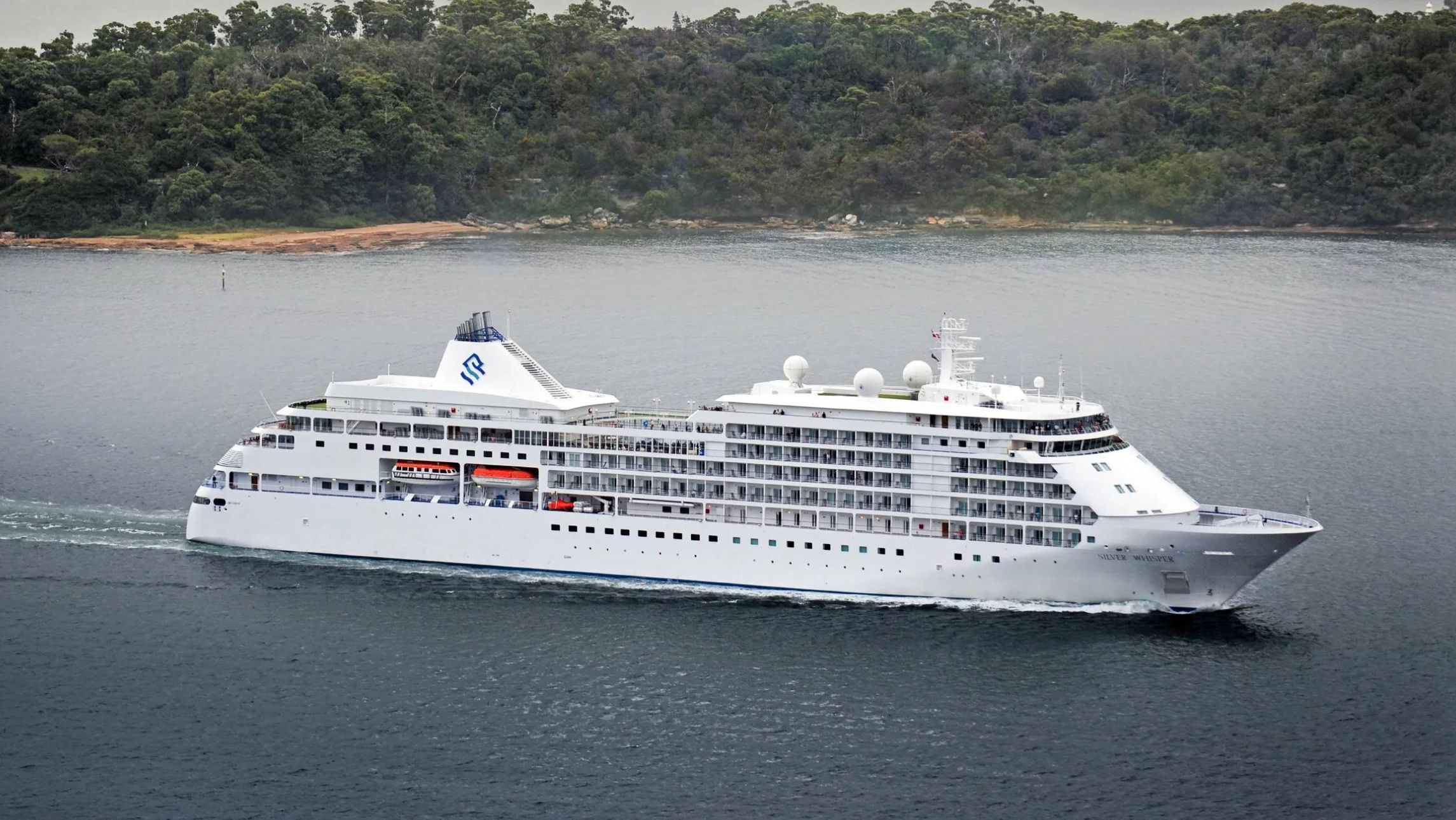 The Silver Muse in Sydney Harbour with the Sydney Harbour Bridge in the background