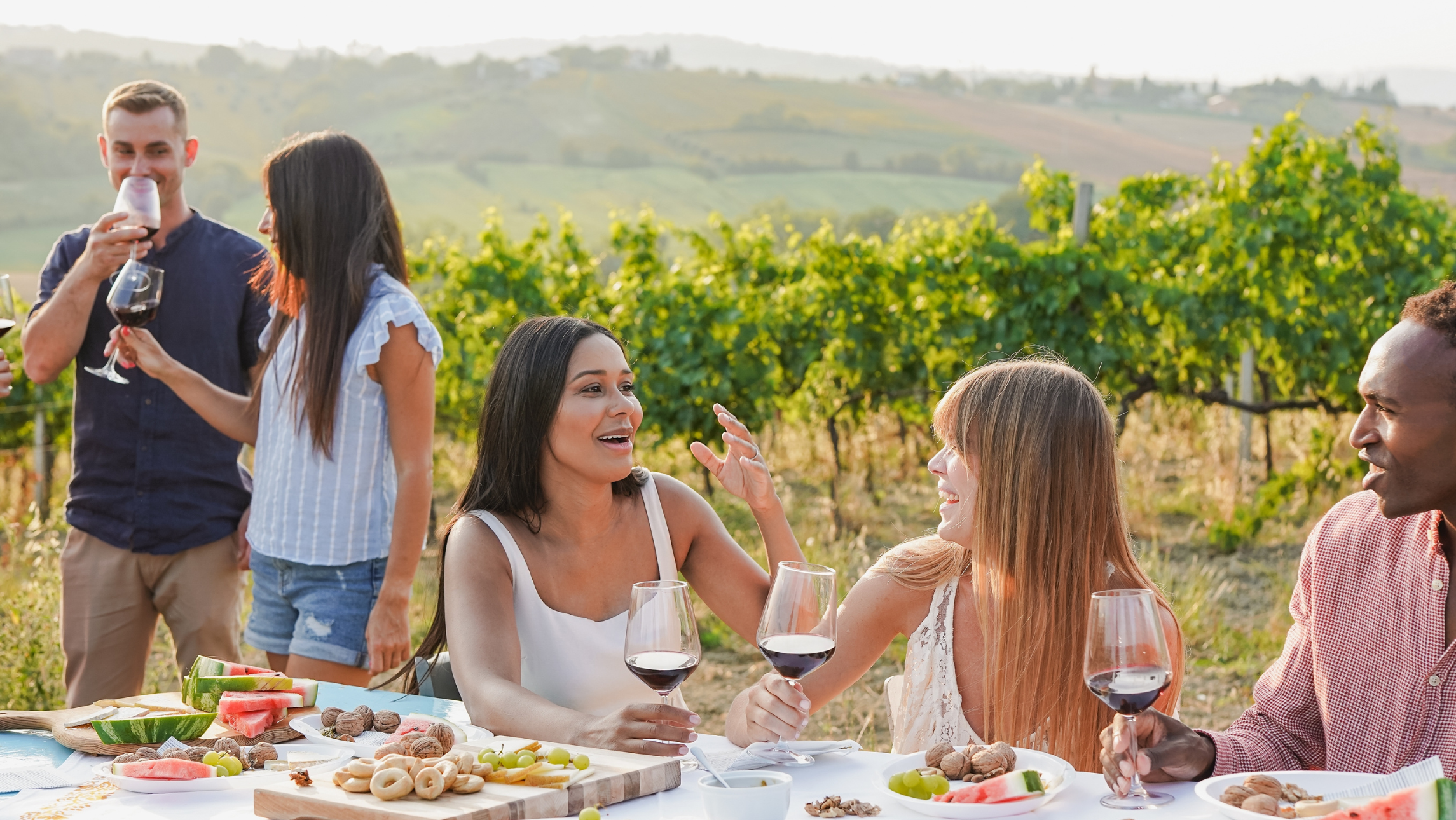friends talking drinking wine