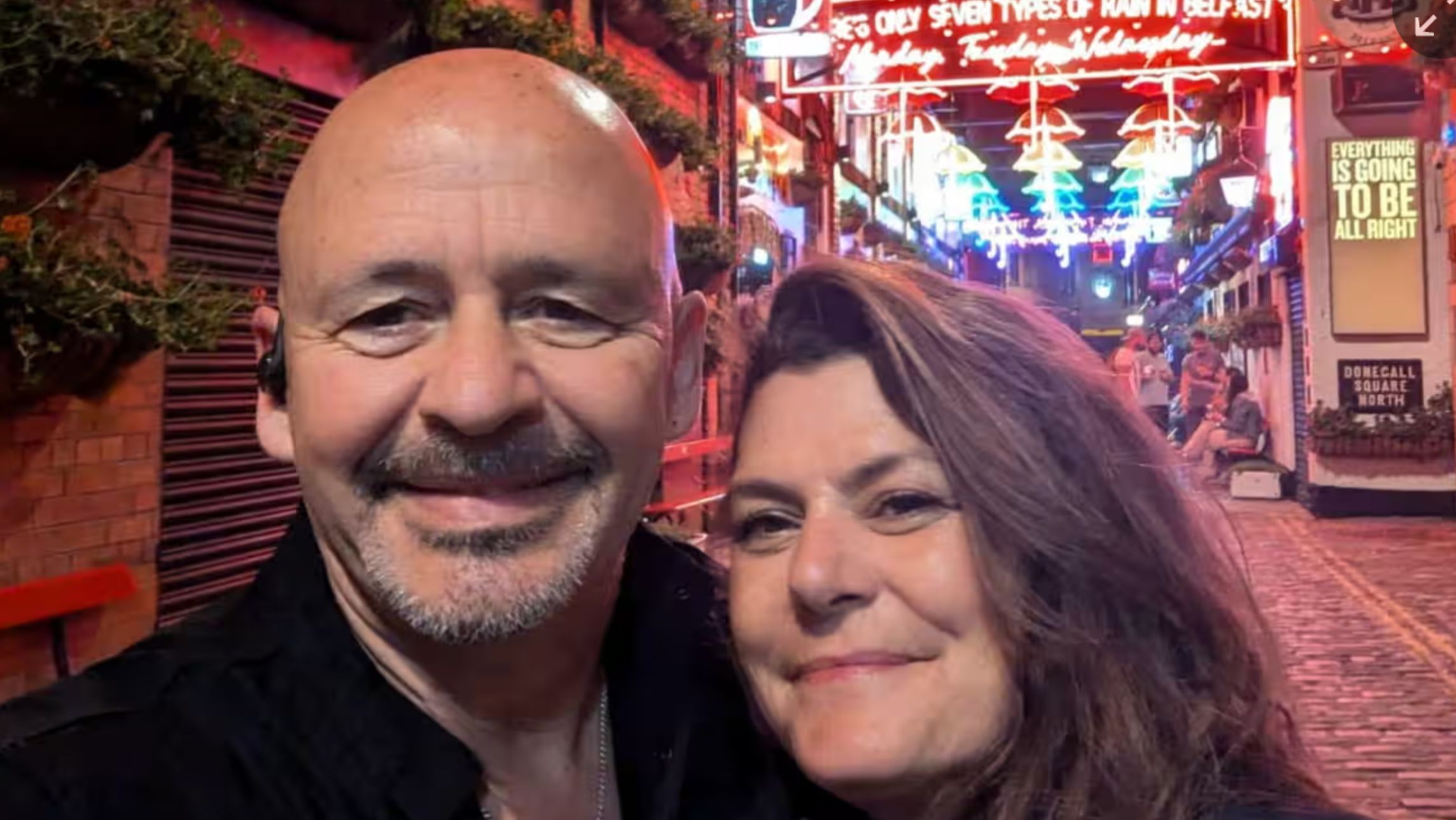 The smiling couple who got engaged in Belfast.
