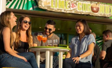 Royal Caribbean passengers enjoying a drink together.