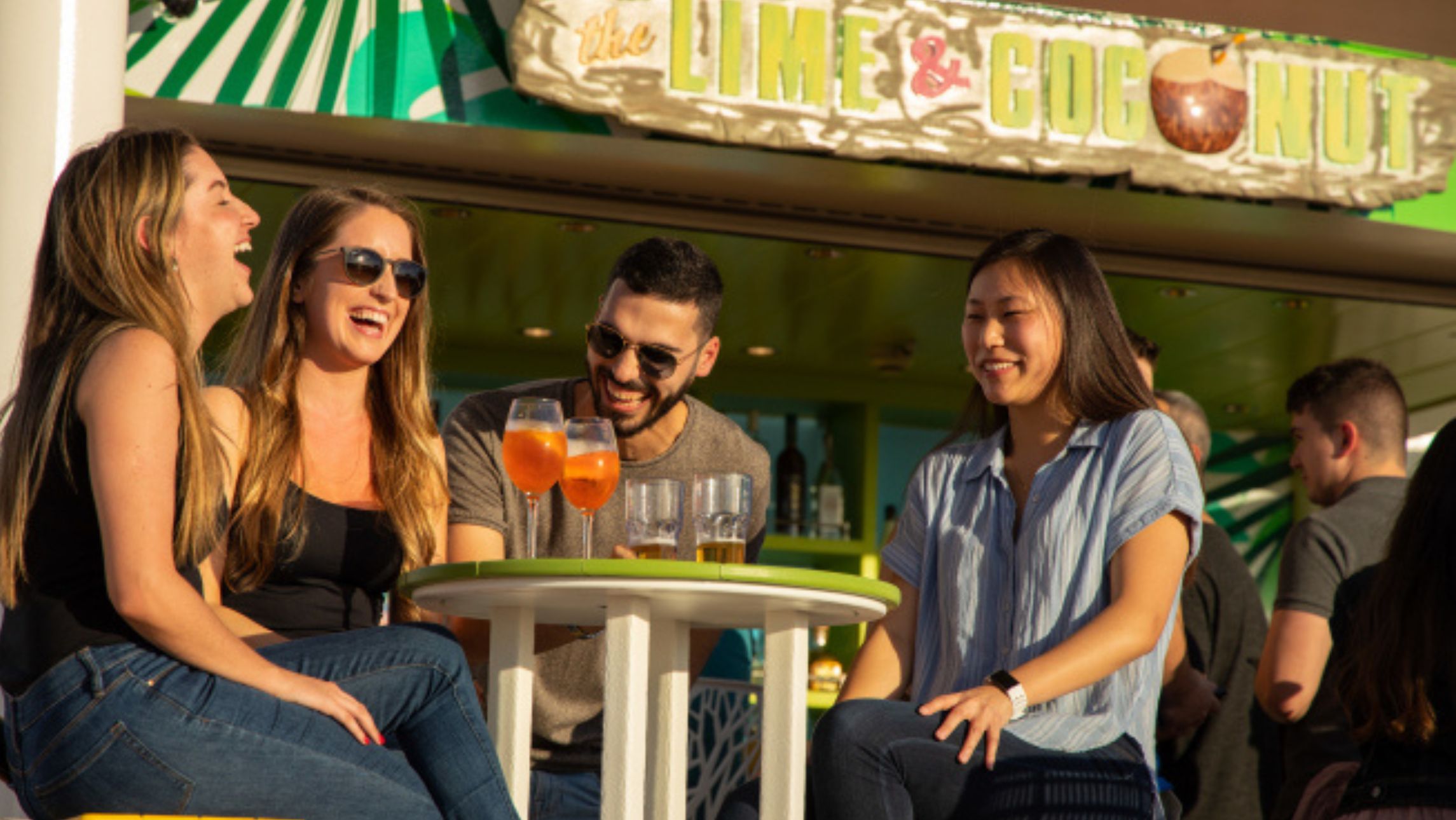 Royal Caribbean passengers enjoying a drink together.