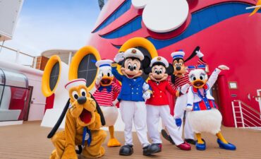 Disney Mascots hugging on a cruise ship.